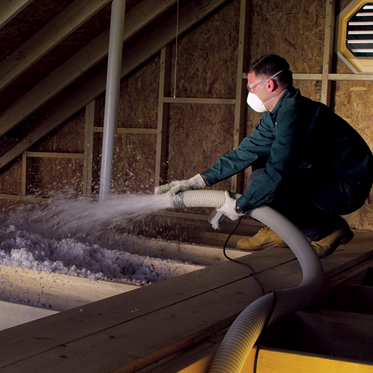 BGE HOME technician installing attic insulation